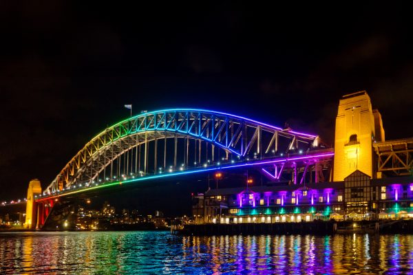 The Sydney Harbour Bridge, lit up in rainbow coloured lights for the Vivid Sydney festival.